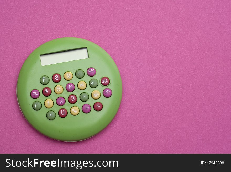 Unique Green Brigth Calculator on Vibrant Pink Background.