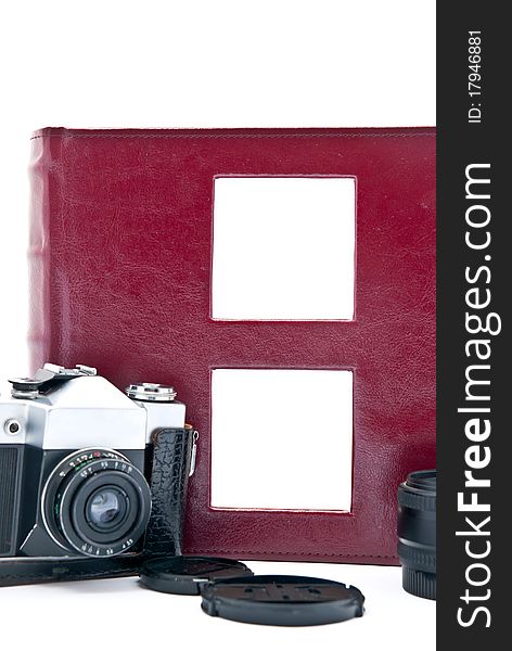Retro camera and red photo album with empty pictures. Retro camera and red photo album with empty pictures