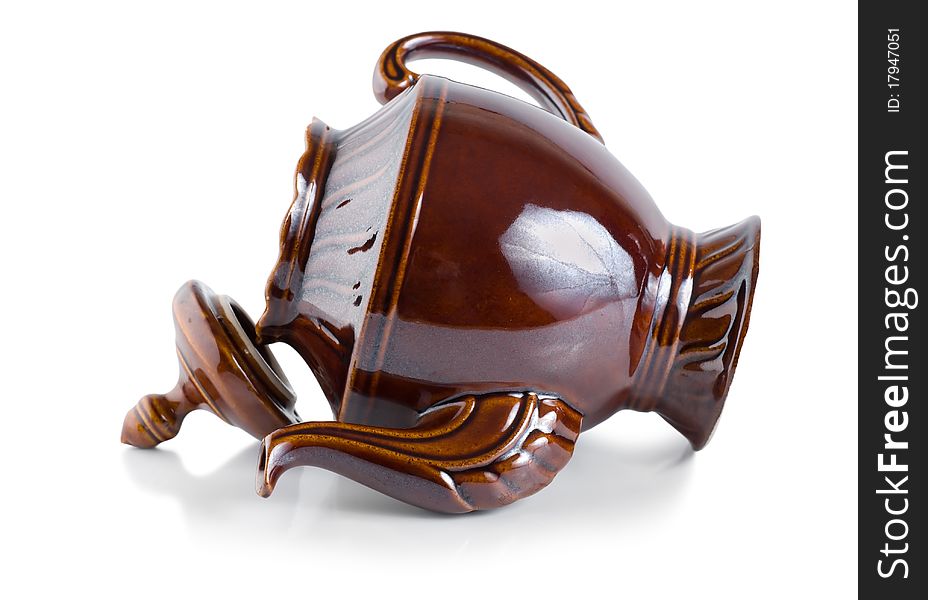 Brown ceramic teapot isolated on a white background