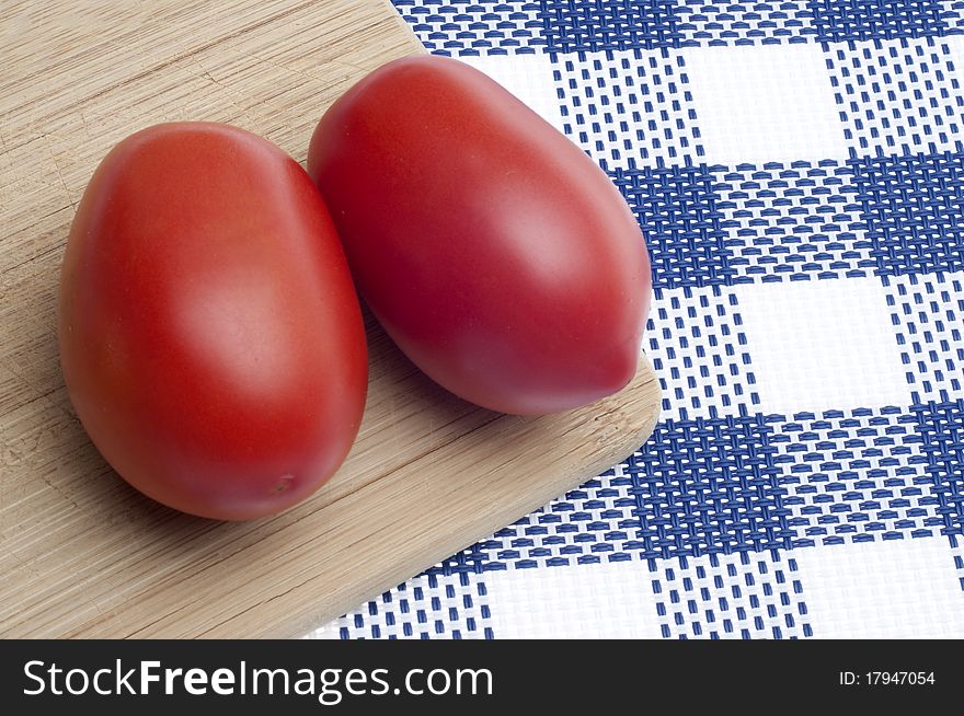 Pair of Fresh Roma Tomatoes Kitchen Background.