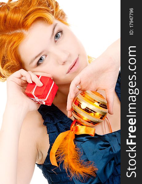 Redhead posing with christmas gift on white