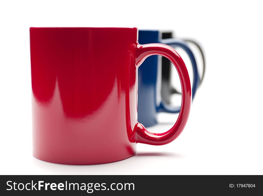 Three colorful cups on a white background