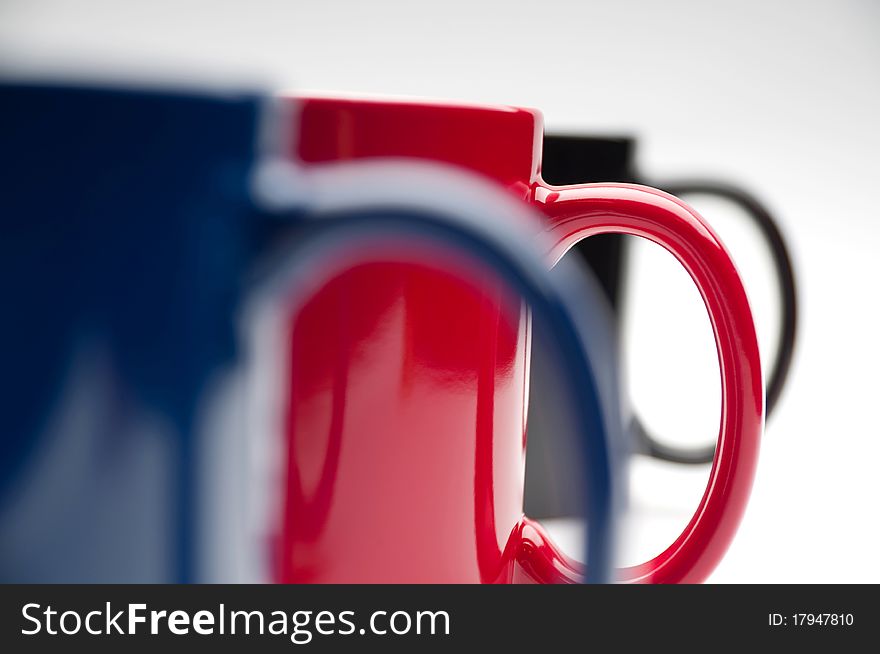 Three colorful cups on a white background