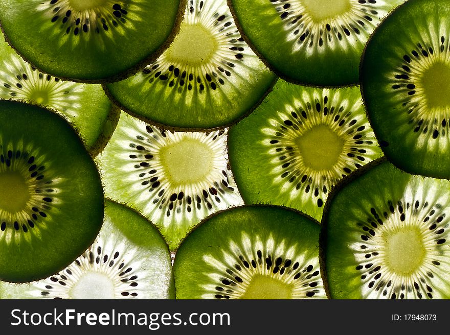 Many slices of fresh green kiwi fruit. Many slices of fresh green kiwi fruit
