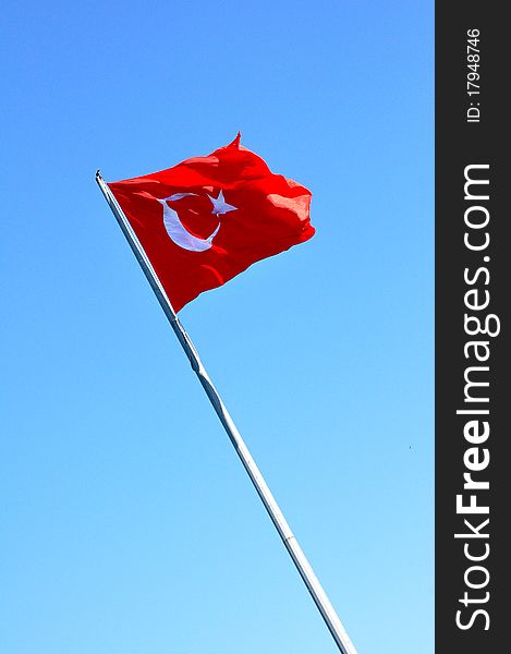 Turkish flag with a clear blue sky