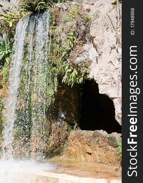 Waterfall and grotto in the Genoves park in Cadiz