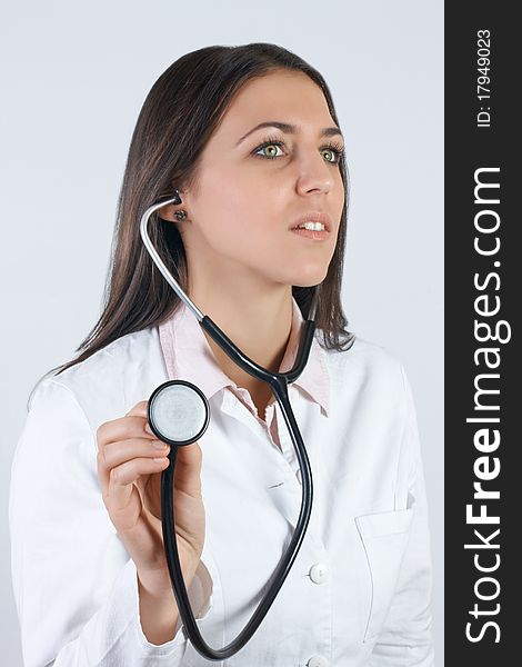 Portrait of friendly female doctor with stethoscope. Portrait of friendly female doctor with stethoscope.