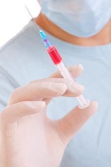 Medical Syringe In Hands Royalty Free Stock Image