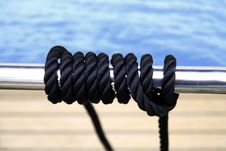 Black Sailing Rope On The Metal Pipe Royalty Free Stock Image Black Sailing Rope On The Metal Pipe Royalty Free Stock Image