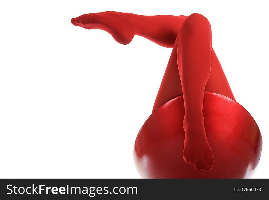 Female feet in red stockings isolated in white