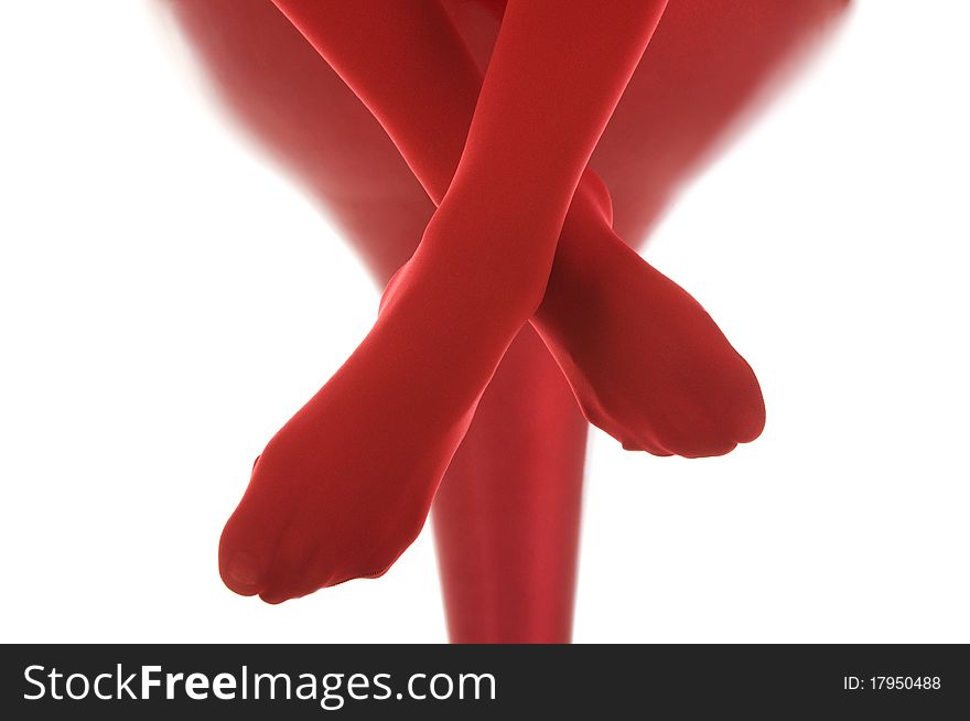 Female feet in red stockings isolated in white