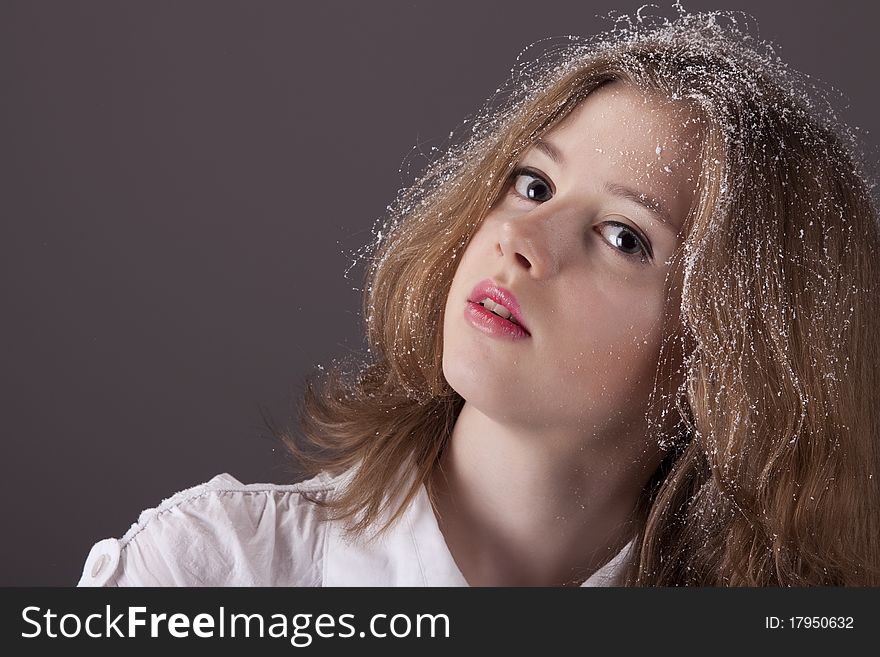 Portrait of the teenage girl with snow in hair. Portrait of the teenage girl with snow in hair