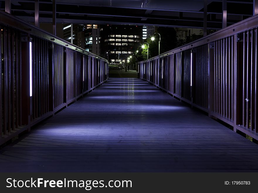 Small bridge along the canal,the light shines in the feet. Small bridge along the canal,the light shines in the feet