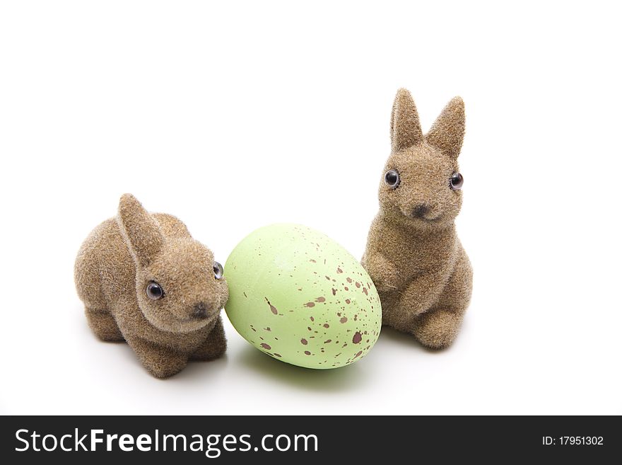 Easter bunnies with egg onto white background