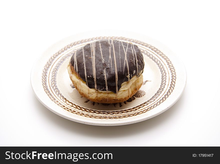 Donut with chocolates glaze onto plates