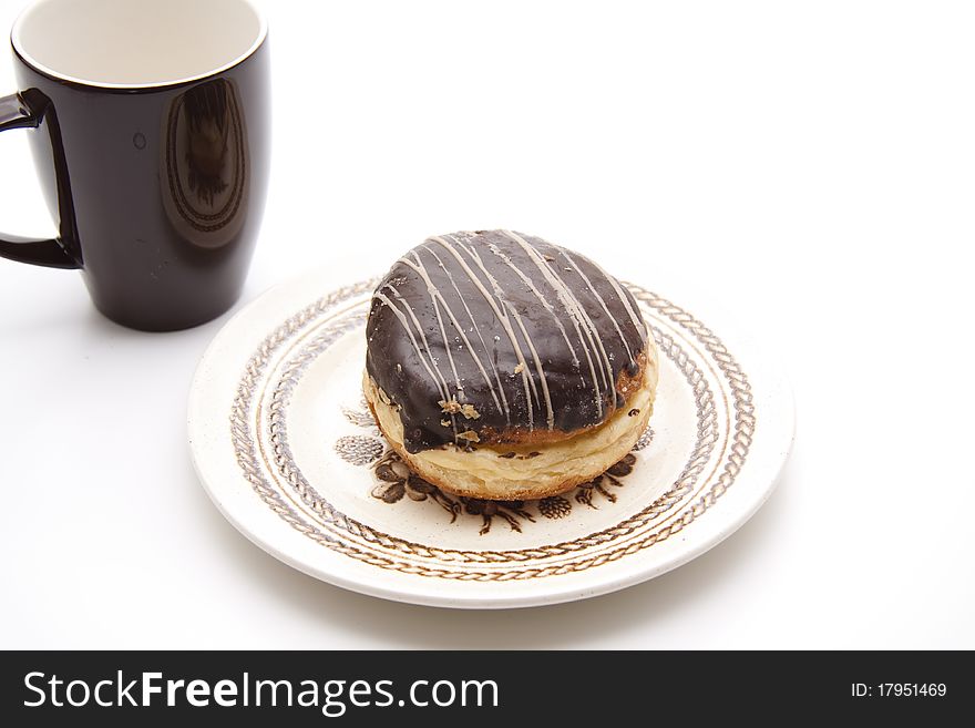 Donut with chocolates glaze onto plates. Donut with chocolates glaze onto plates