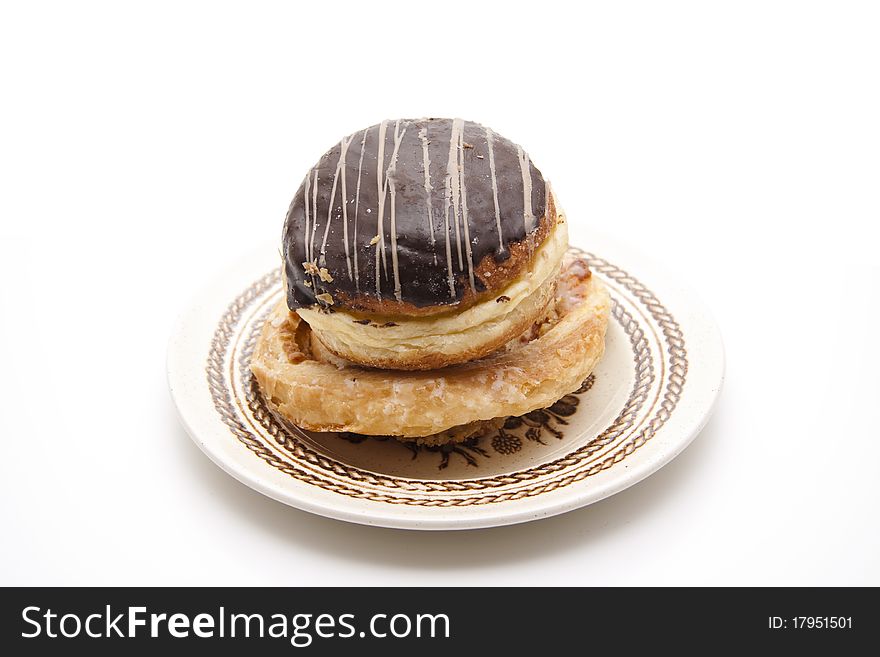 Donut with chocolates glaze onto plates