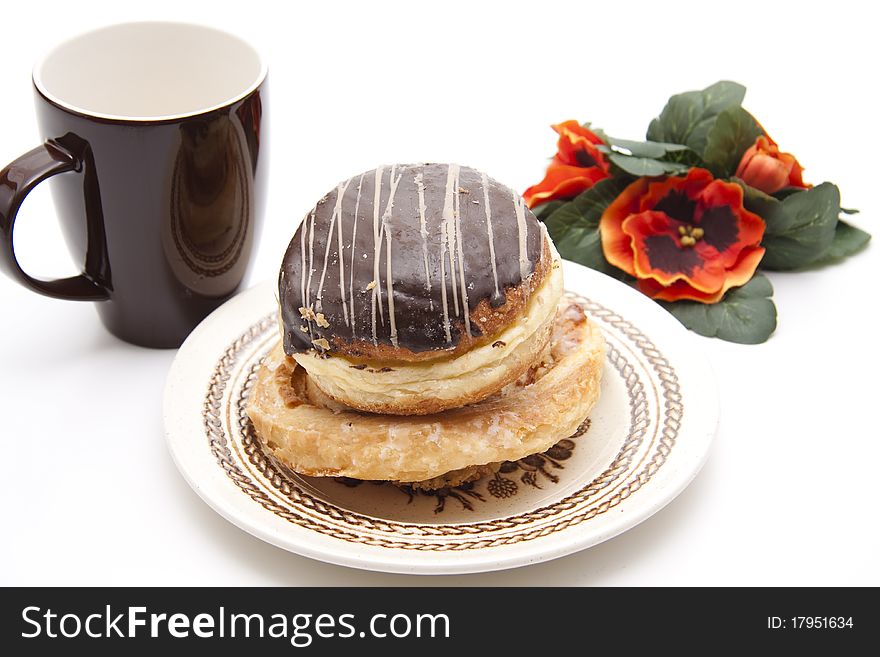 Donut with chocolate and coffee cup