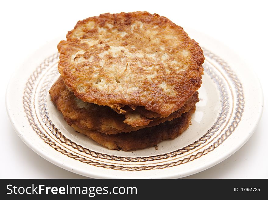 Potato pancakes crisply baked and onto plates