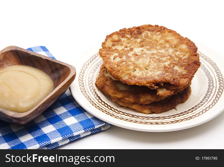 Potato pancake crisply baked with apple porridge and tablecloth