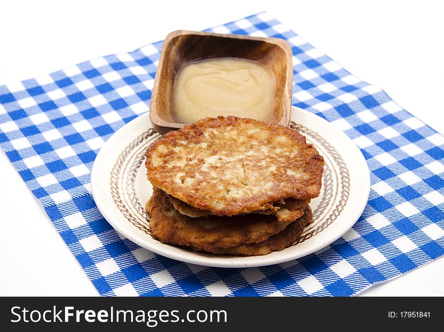 Potato pancake crisply baked with apple porridge and tablecloth