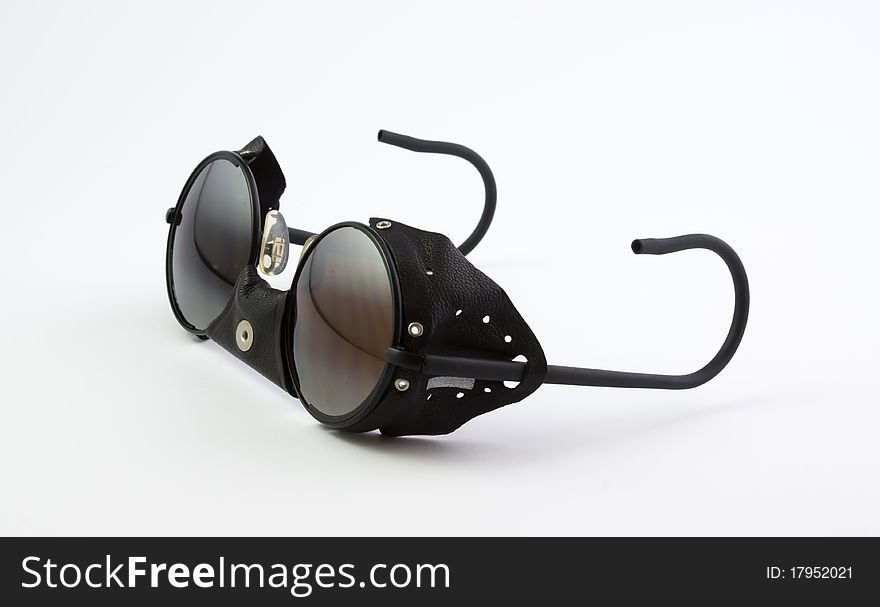Leather shield sunglasses, special mountain, on white background. Leather shield sunglasses, special mountain, on white background