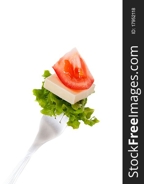 Fork witj a bite of salad isolated on white. Fork witj a bite of salad isolated on white