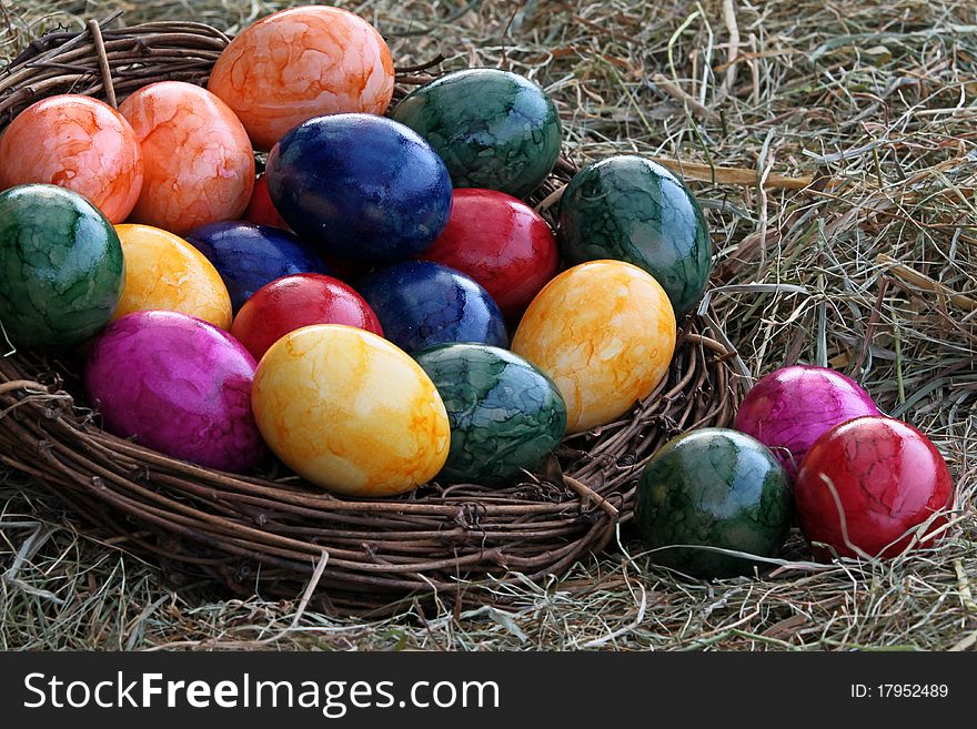Colorful easter eggs in the hay