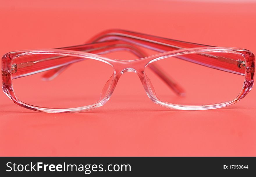 Woman glasses isolated on red background