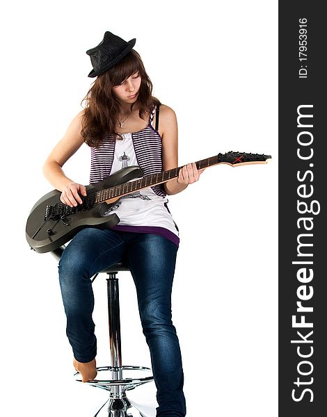 Beautiful girl playing the guitar isolated on white