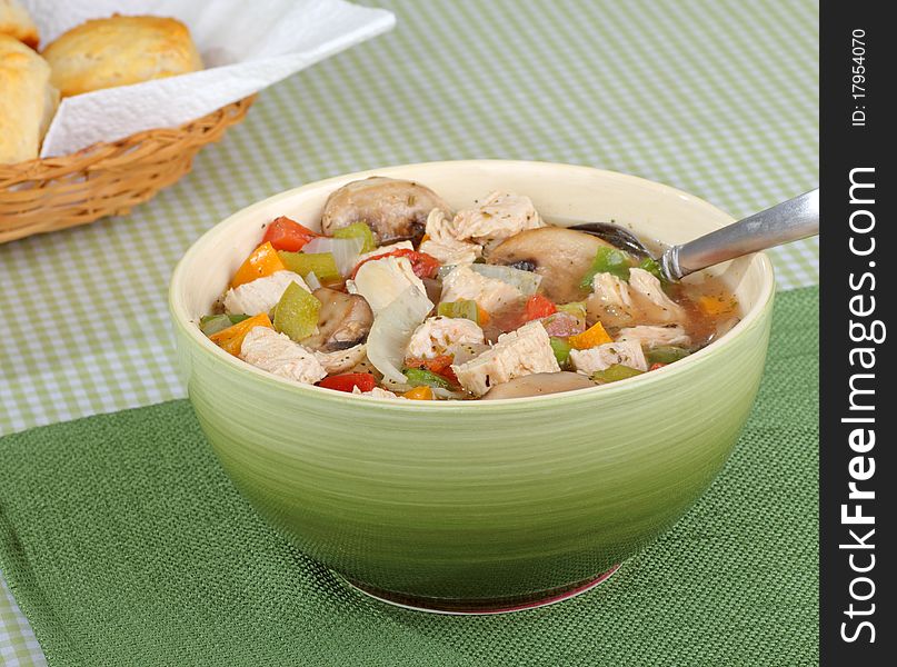 Chicken soup with mushrooms and vegetables in a bowl. Chicken soup with mushrooms and vegetables in a bowl