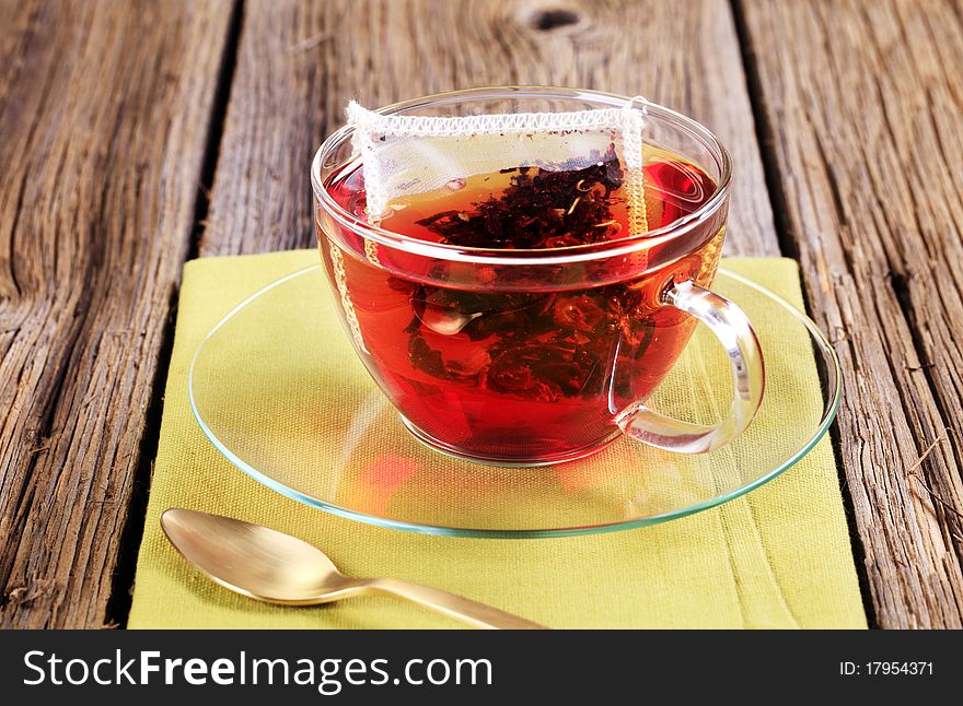 Fruit tea in a glass cup - closeup