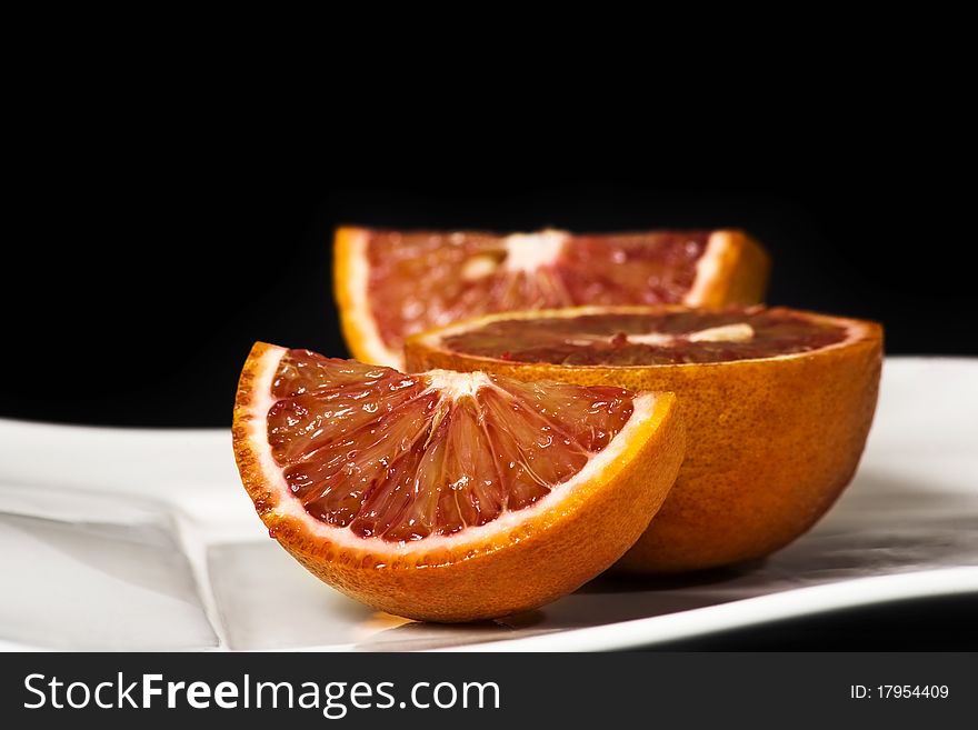 Orange slice shot in the studio isolated on black. Orange slice shot in the studio isolated on black.