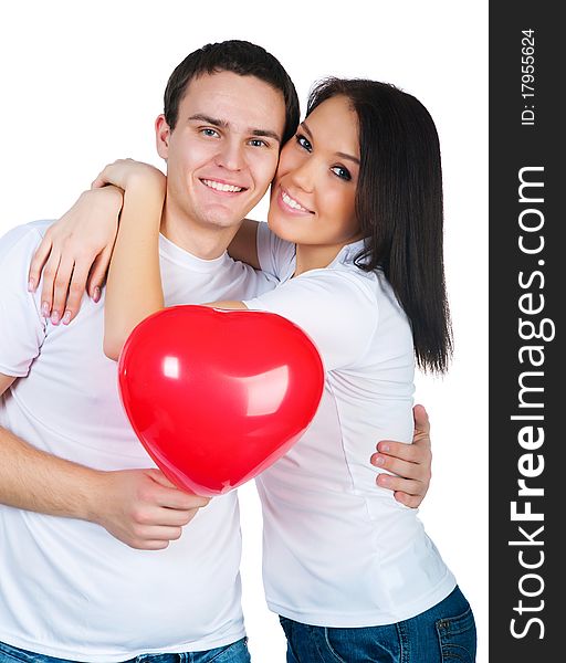 Young couple with a heart over white background