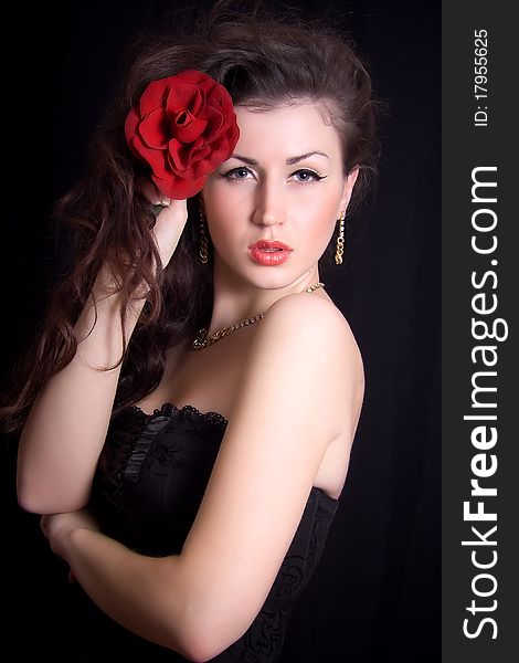 Beautiful Girl With A Red Rose In Her H