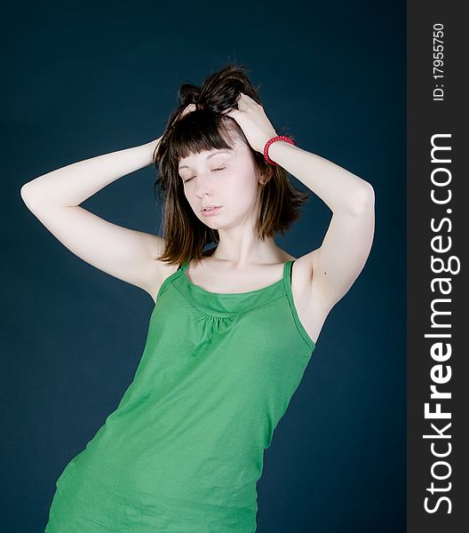 Girl with closed eyes on a black background
