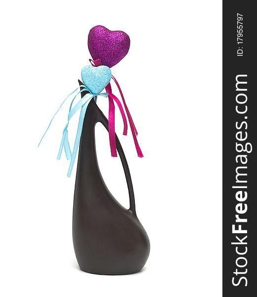 Two hearts of different colors in an elegant vase
