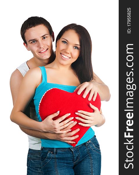 Young couple with a heart over white background