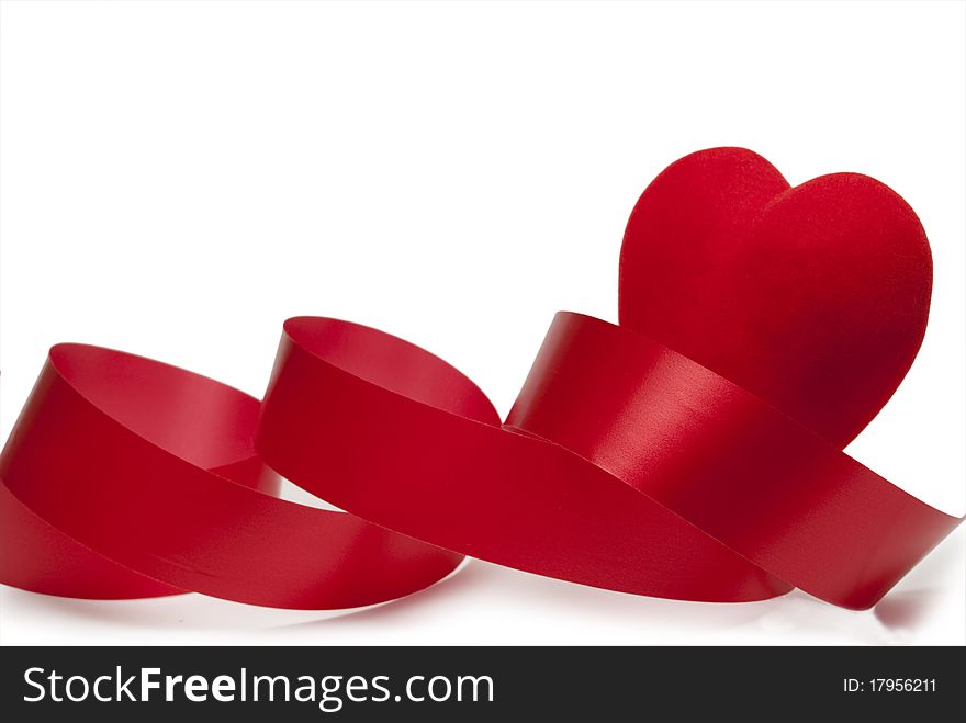 Ribbon and red heart on a white background. Ribbon and red heart on a white background.