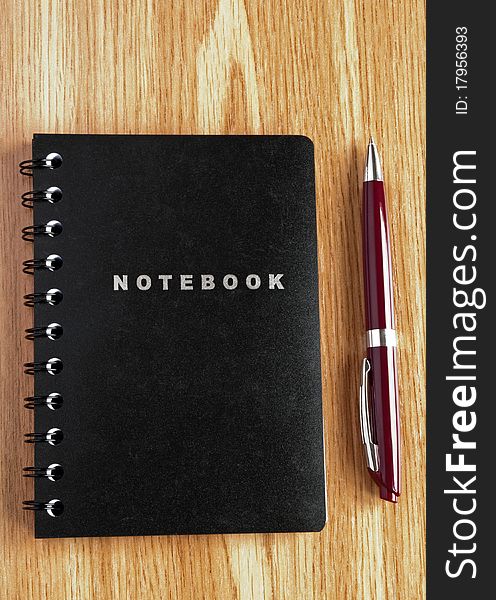 Notebook and pen on the table