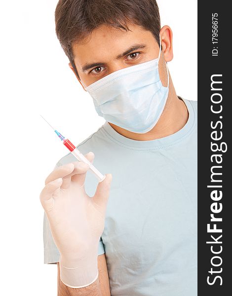 Professional doctor with medical syringe in hands, getting ready for injection