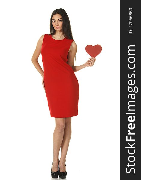 Young elegant female in red pencil-dress holding heart shape isolated on white. Young elegant female in red pencil-dress holding heart shape isolated on white