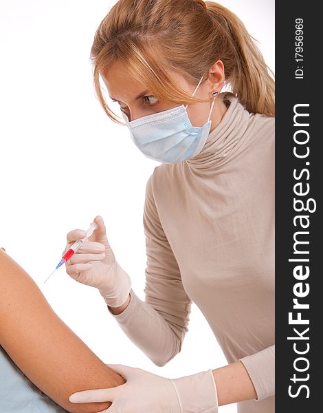 Professional doctor with medical syringe in hands, getting ready for injection