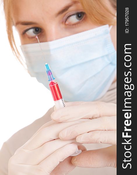 Professional doctor with medical syringe in hands, getting ready for injection