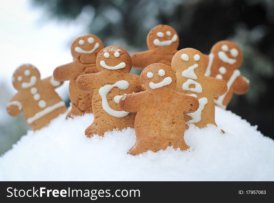 Gingerbread men, all smiling on the snow. Gingerbread men, all smiling on the snow.