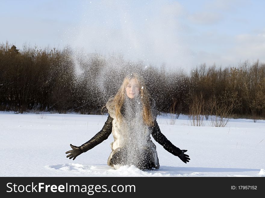 Girl having fun in winter field