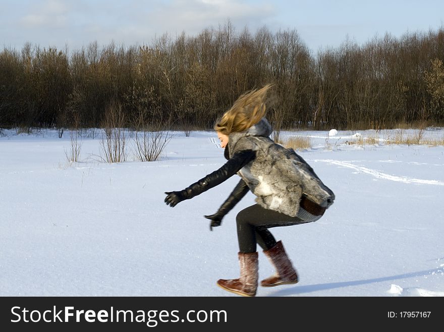 Girl having fun in winter field