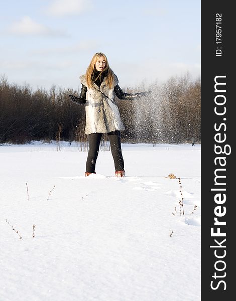 Girl walking in winter field