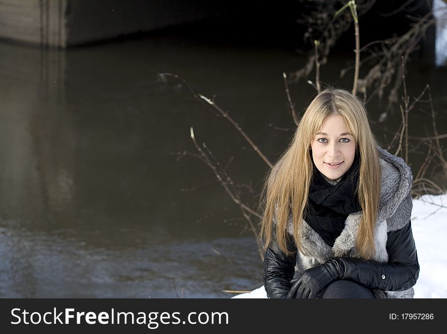 Closeup portrait of a pretty girl in winter park