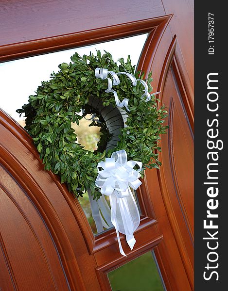 Wedding Wreath With White Bow On Door